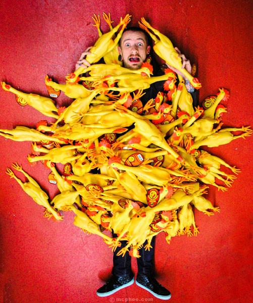 Man Covered With Deluxe Rubber Chickens