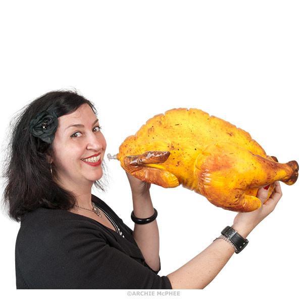 Woman Blowing Up Inflatable Turkey