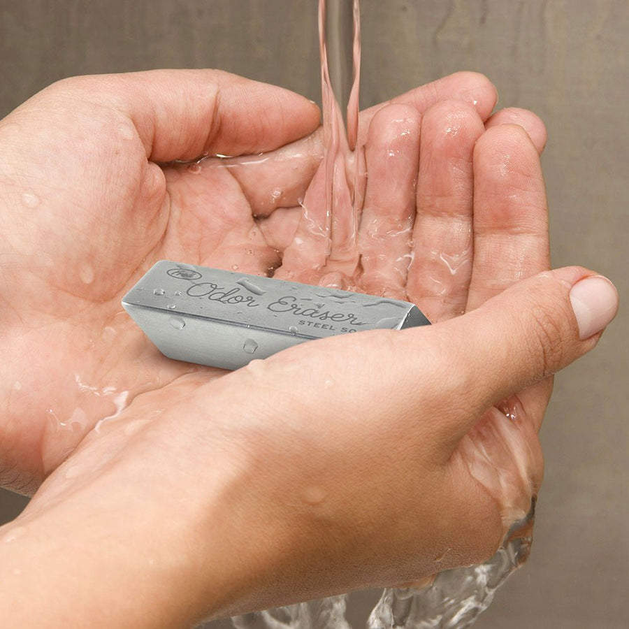 Hands Holding Odor Eraser With Water 
