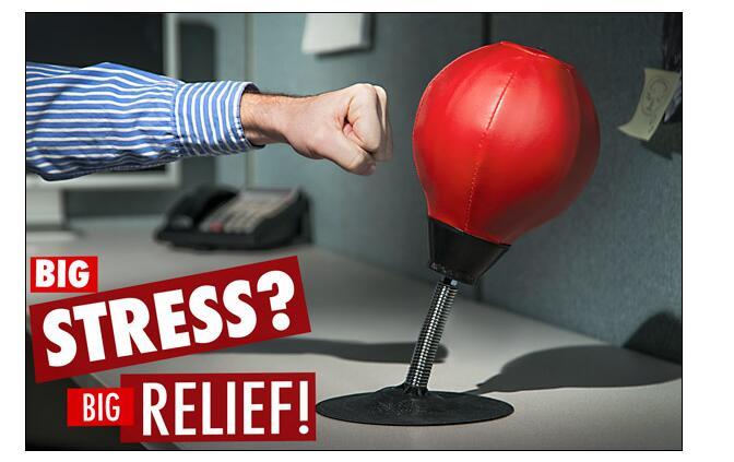 Stress Buster Punching Bag Being Punched On Desk By A Fist